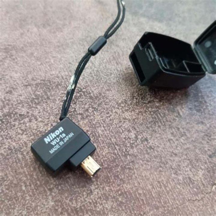 How do I connect my Nikon WU 1a to my iPhone?