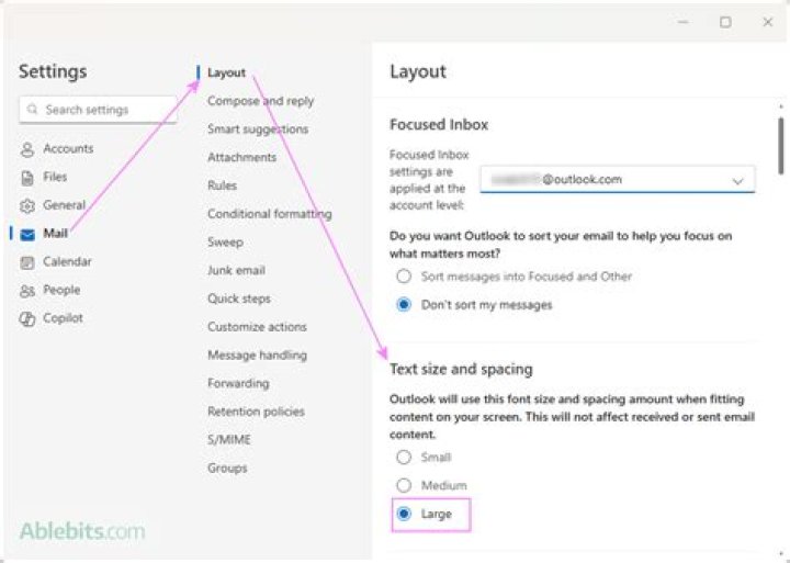 How do I increase the text size in my emails?