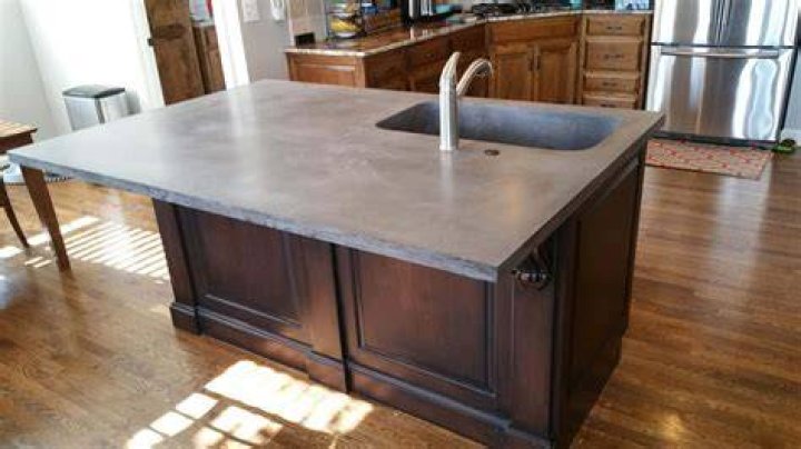 How do you attach a sink to a concrete countertop?
