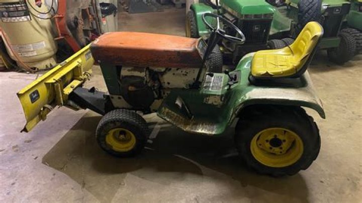 How do you install a plow on a lawn tractor?