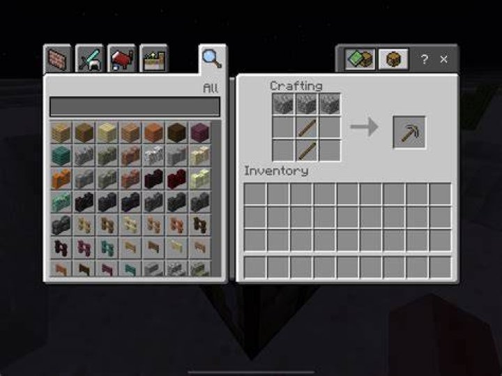How do you make a metal pickaxe in Minecraft?