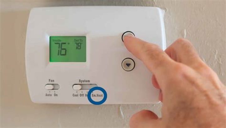 How do you reset the thermostat on a tumble dryer?
