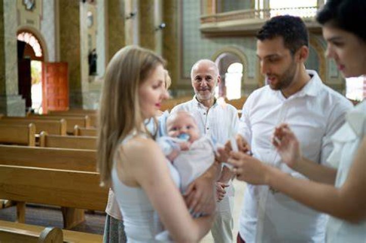 What is the responsibility of Catholic godparents?