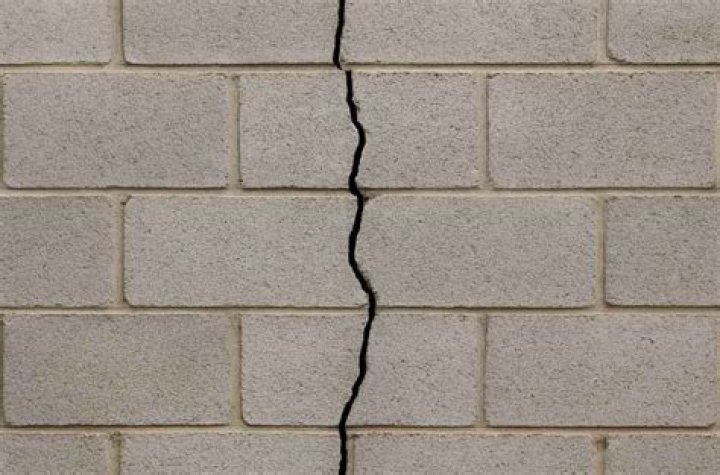 Why is my newly painted wall cracking?